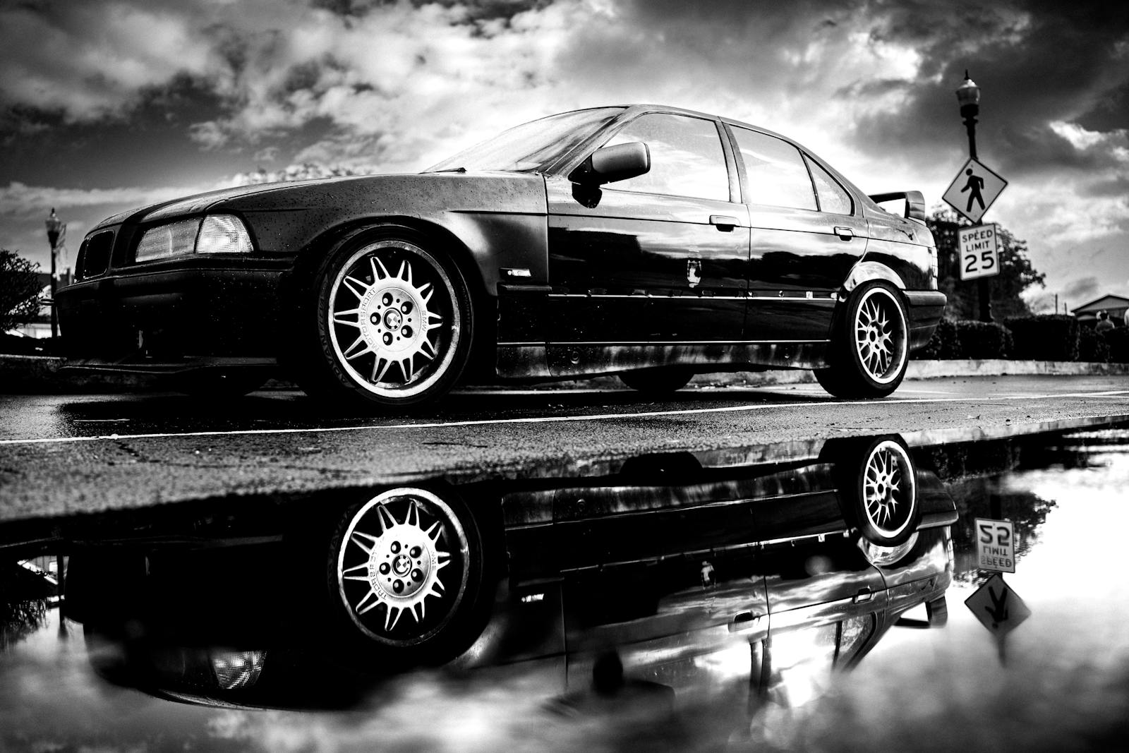 Reflection on a polished black vehicle
