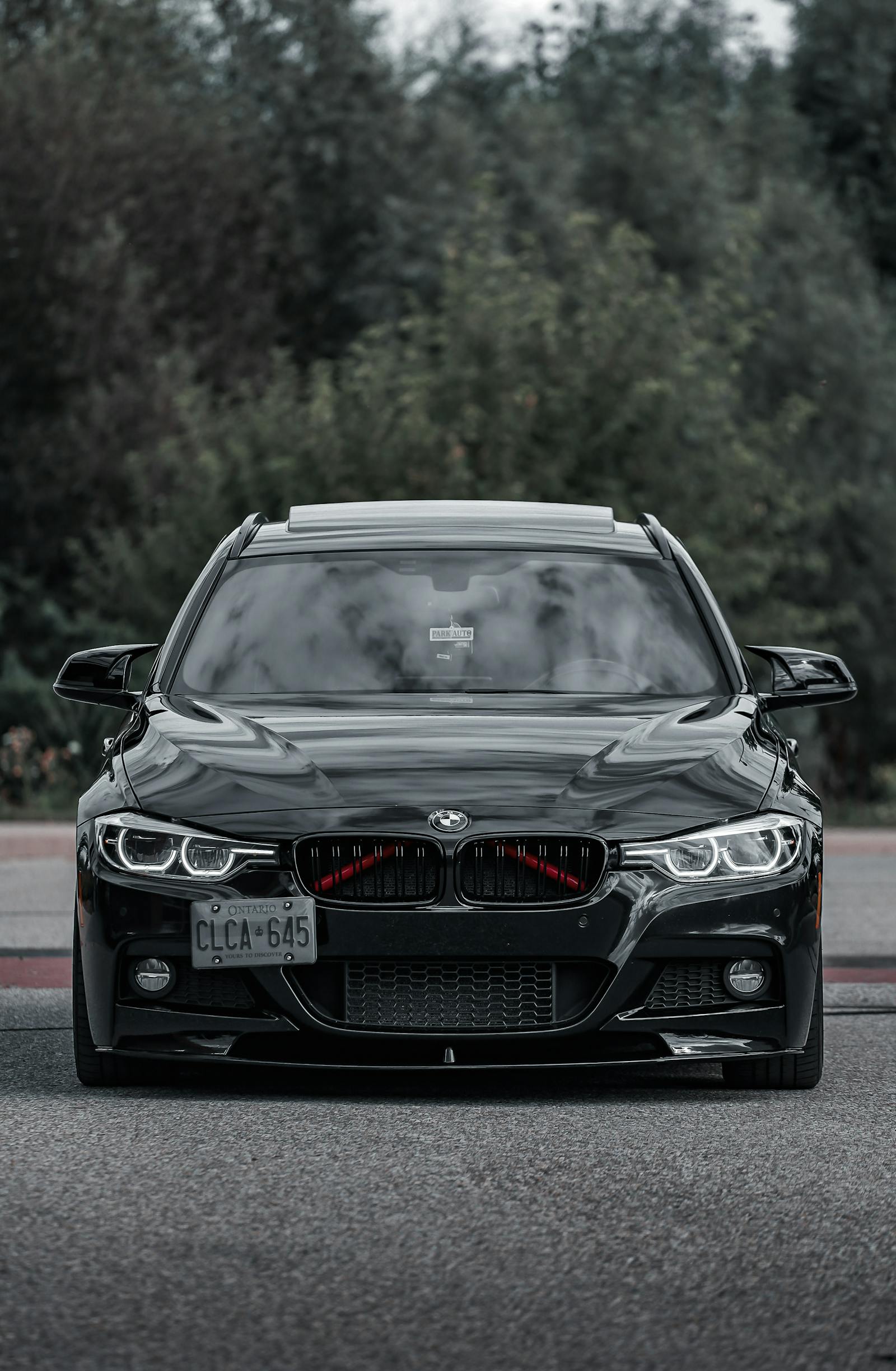 Front of a glossy black luxury vehicle